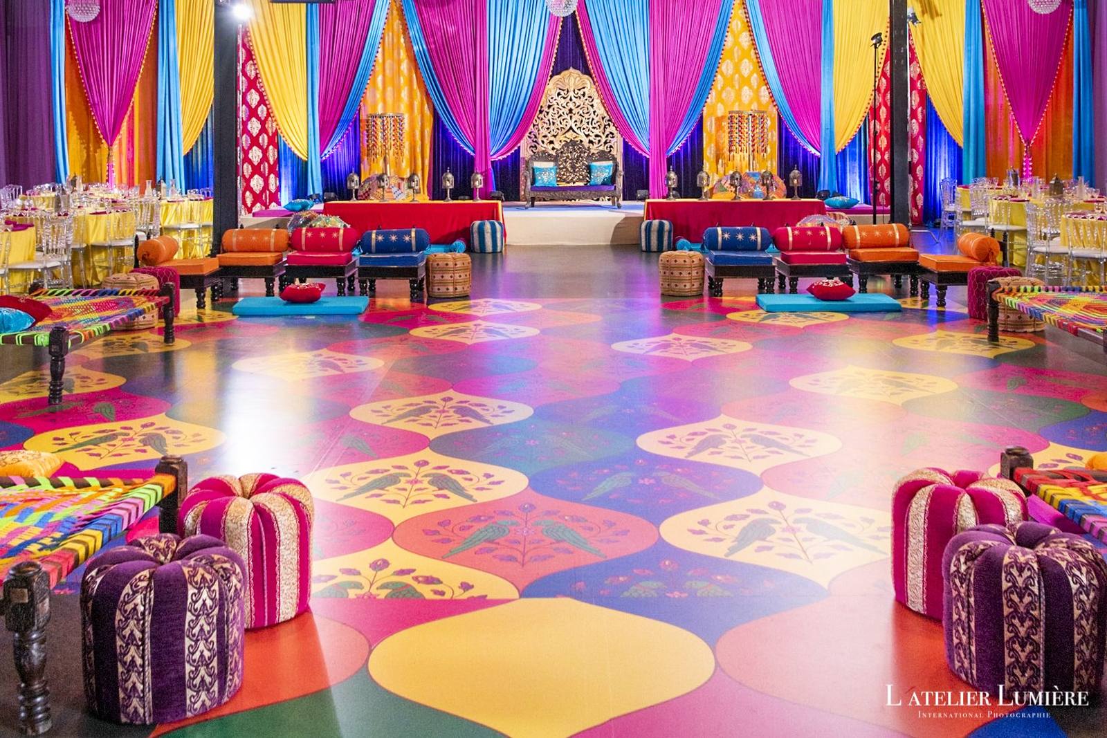 A full-colour printed dance floor covering a sangeet room, patterned edge to edge.